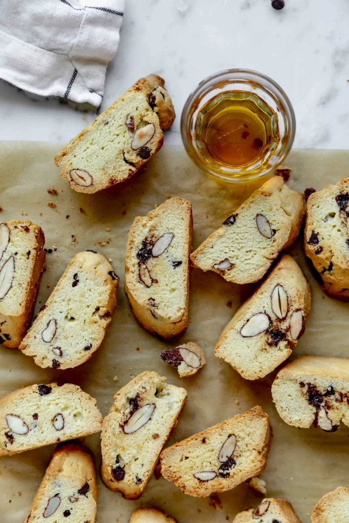 Biscotti with almonds and honey on a baking sheet.