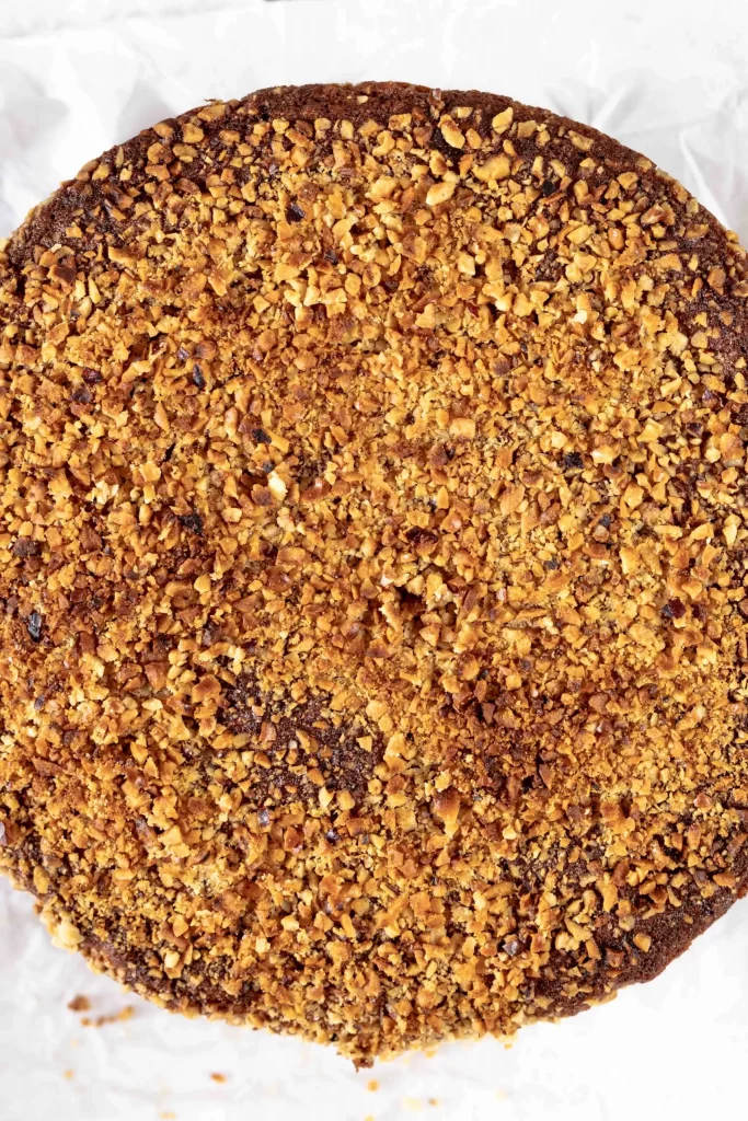 A chocolate cake with granola on top.