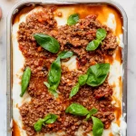A lasagna with meat and cheese in a baking dish.