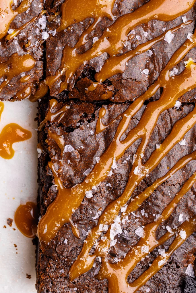 Sliced Freshly baked chocolate brownies drizzled with caramel